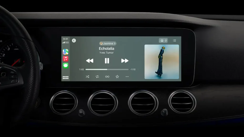 Still from Apple's WWDC 2023 conference keynote showing SharePlay integration on a Carplay vehicle. Yves Tumor's Echolalia is playing. 