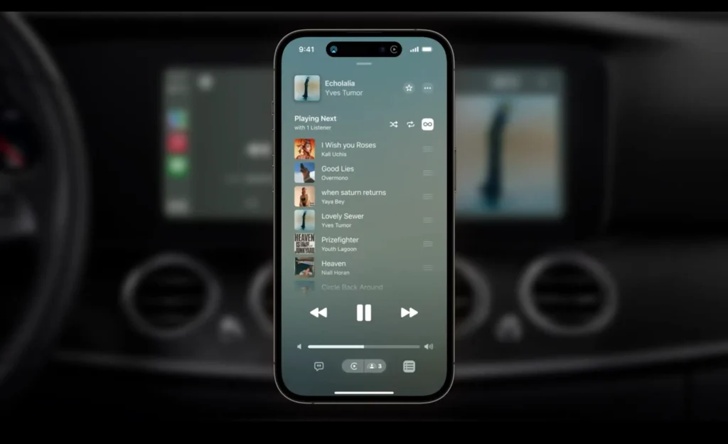 Still from Apple's WWDC 2023 conference keynote showing SharePlay integration making a shared playlist on an iOS 17 device. 