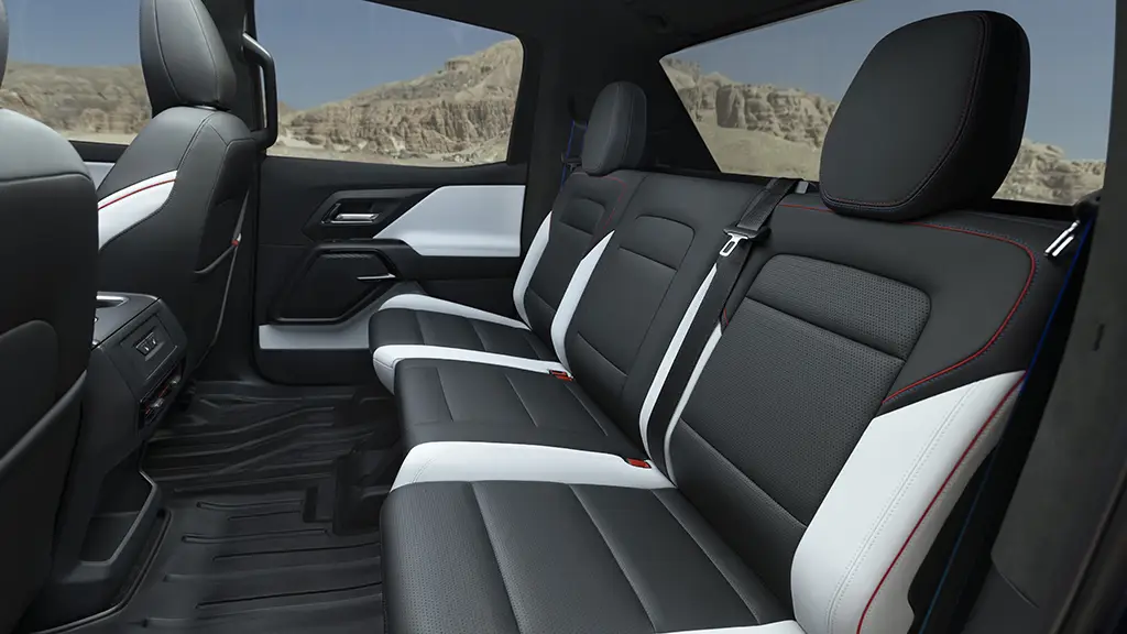 We see the rear seats of a Chevy Silverado EV. The leg room is ample. 
