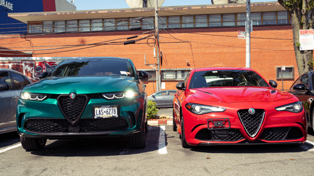 2024 Alfa Romeo Tonale (left) parked next to a red 2018 Alfa Romeo Giulia Quadrifoglio