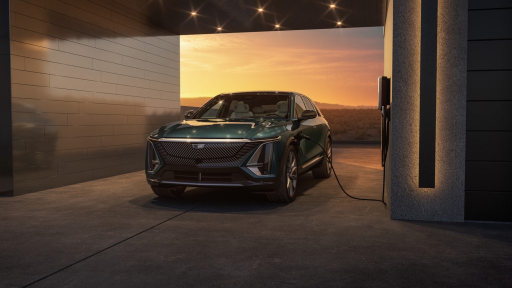 2024 Cadillac Lyriq plugged into a Level 2 charger inside a home garage