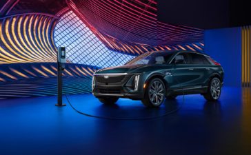Cadillac Lyriq charging on a luminous stage