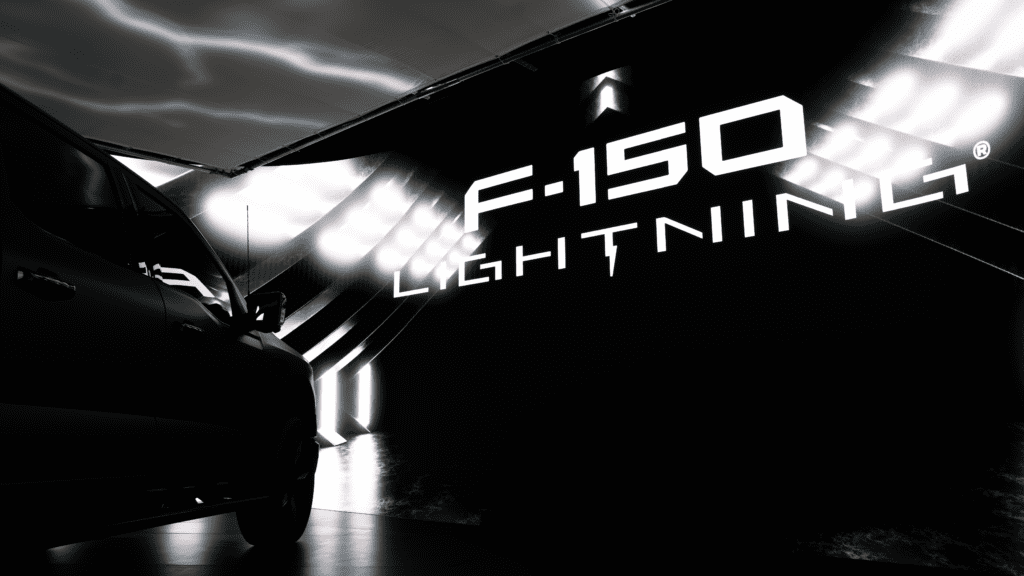 2024 Ford Lightning Platinum Black silhouette facing large 'F-150 Lightning' text logo