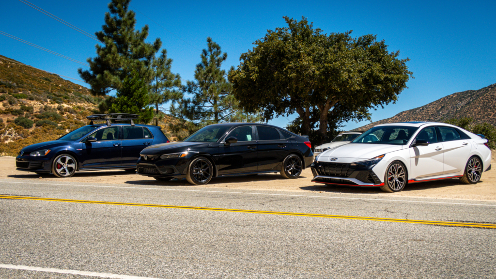 2023 Hyundai Elantra N parked next to black Honda and blue VW