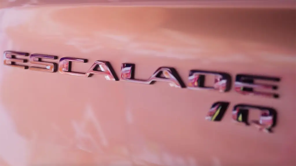 We see the side emblem of a Cadillac Escalade IQ