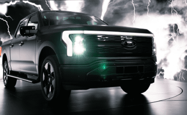 2024 Ford Lightning Platinum Black with headlights on