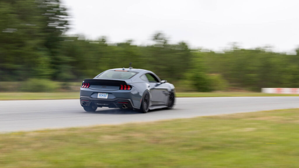 RTR Mustang accelerating out of corner