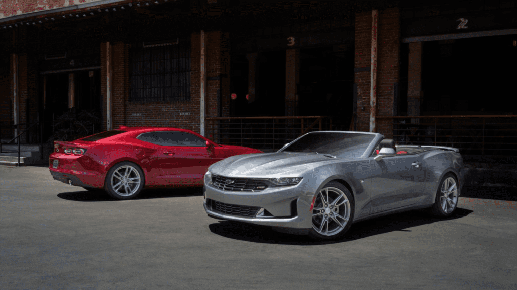 2023 Camaro (silver) and 2023 Camaro (red) facing opposite directions