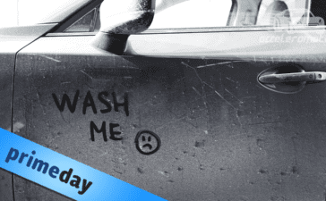 "Wash me" written by finger on a dusty car