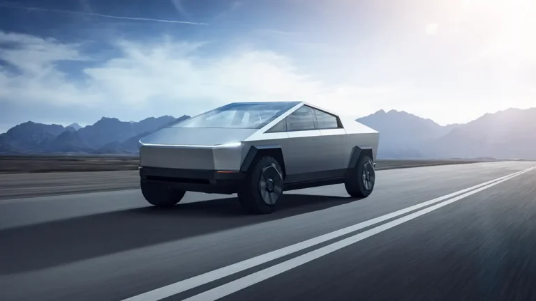 A Tesla Cybertruck is seen cruising on a highway.