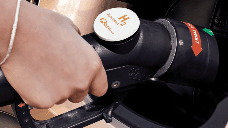 Plugging in a 2023 Hyundai Nexo at a hydrogen fuel cell electric vehicle (FCEV) station