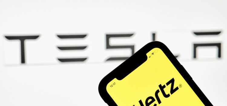 Hertz app running on an iPhone with Tesla logo in the background