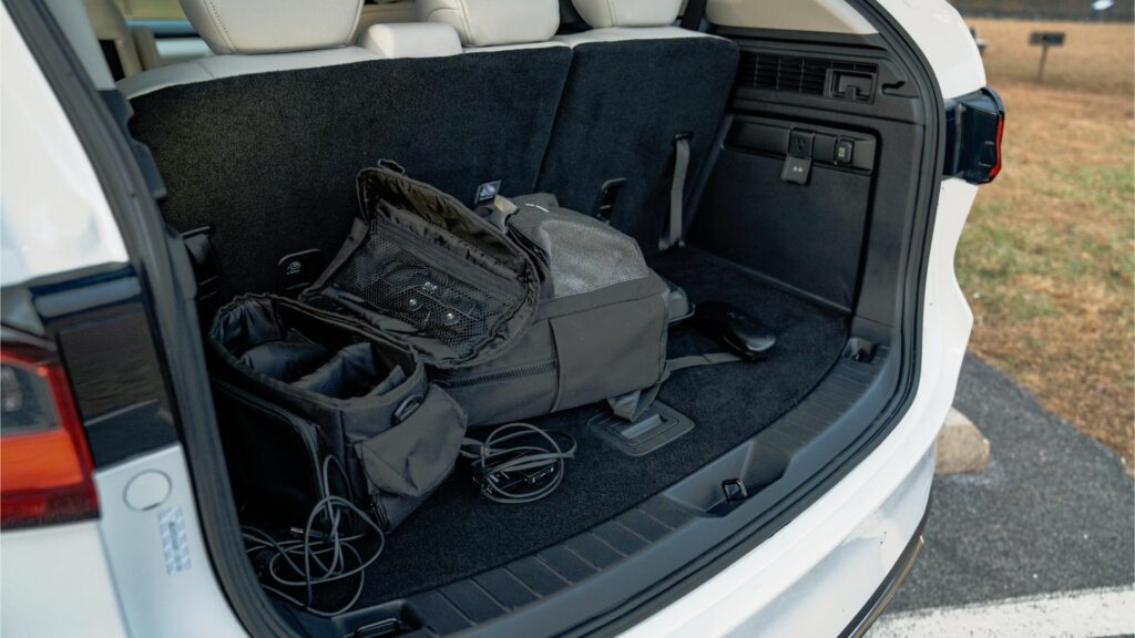 2024 Mazda CX-90 PHEV cargo area containing photo gear