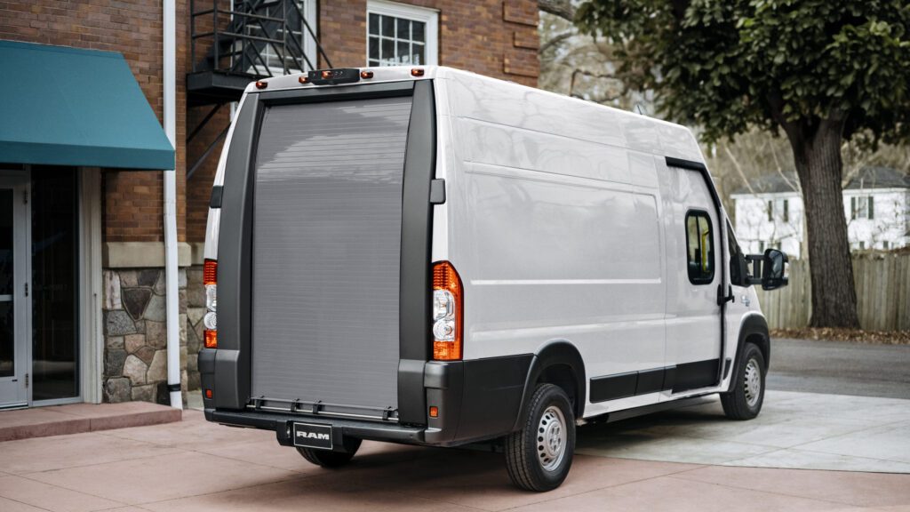 Ram ProMaster EV parked outside residential building