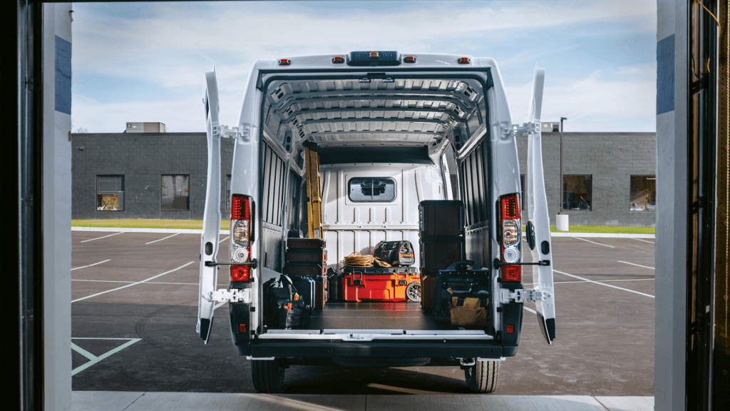Ram ProMaster EV from behind, carrying equipment with rear doors open