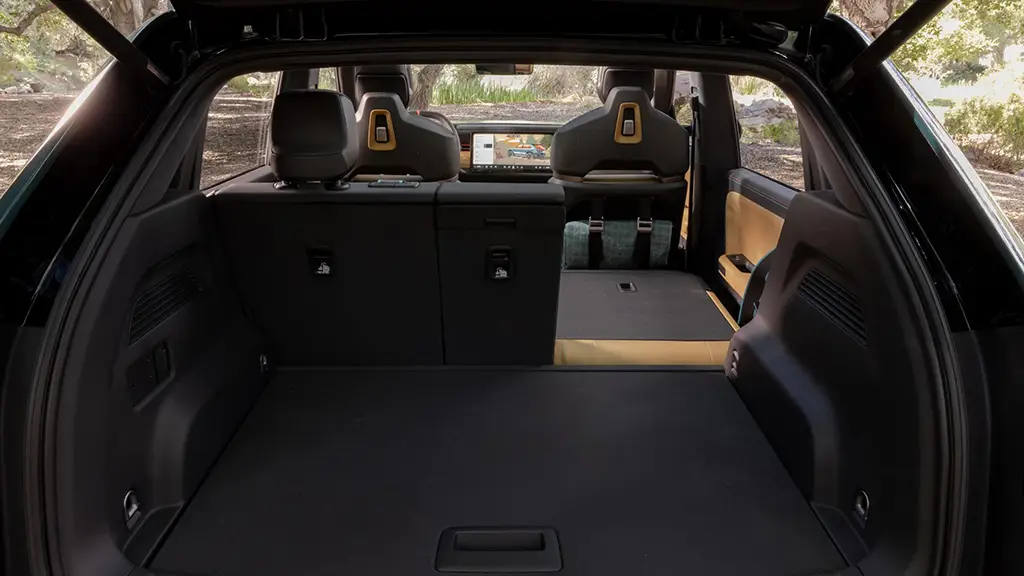 We see a Rivian R3 with the seats folded down.